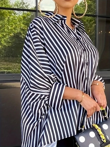 Elegant oversized black and white striped long sleeve shirt with irregular hem and lapel