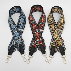 Adjustable wide canvas shoulder straps with ethnic embroidery and gold metal hooks