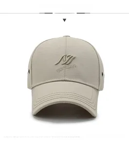 Detailed front view of a beige baseball cap featuring high-quality 3D embroidery on twill fabric