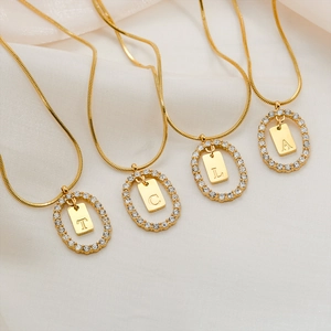 Gold stainless steel oval alphabet necklaces with micro-inlaid diamonds on silk