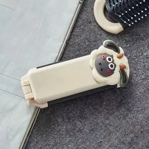 Portable cream-white folding hairbrush with a cute 3D sheep design and built-in mirror