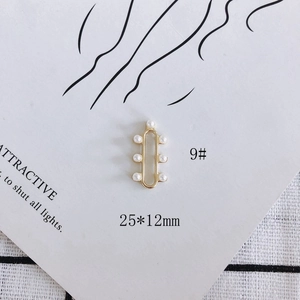 Detail view of 25x12mm gold heart cross pendant with inlaid pearls for DIY jewelry