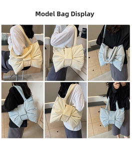 Detail of oversized bow nylon tote bag in beige and blue showing soft texture and style