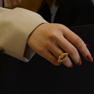 Modern 18K gold plated lip-shaped hollow ring set for women on model's hand