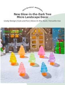 Luminous colorful resin Christmas trees in miniature snowy winter landscape scene