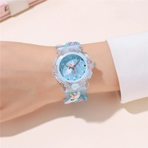 Close-up of children's unicorn watch with transparent resin case on wrist