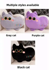 Close-up of cat plush pillows in grey, purple, and black with Lucky embroidery detail