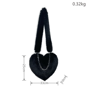 Detailed view of black plush heart-shaped bag showing dimensions of 33x25x10 cm