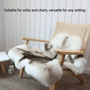 Faux fur reindeer hide rug with brown spots on a chair for modern home decor