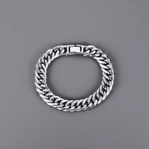 Detailed view of silver Cuban link bracelet with professional folding clasp for men