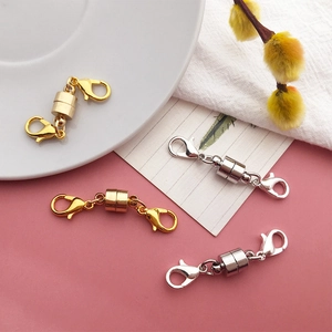 Detail of gold and silver magnetic lobster clasps for DIY jewelry making and crafts