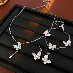 Exquisite silver butterfly jewelry set with zircon necklace, bracelet and earrings on tray