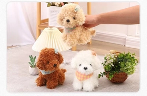 Detailed view of plush teddy dog toys in beige, brown and white with scarves and headbands