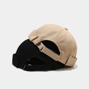Minimalist cotton sailor caps in black and beige with adjustable metal buckles and NEW label