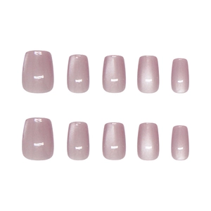 Handmade cat eye press-on nails in dusty rose purple with a short oval shape