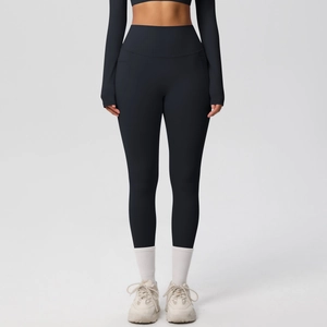 Close-up of black high-waisted yoga leggings and long sleeve top with functional side pockets