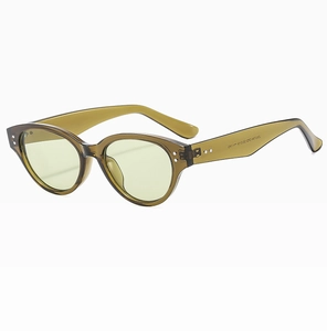 Macro view of vintage cat-eye sunglasses with transparent olive green frame and model ZK3194