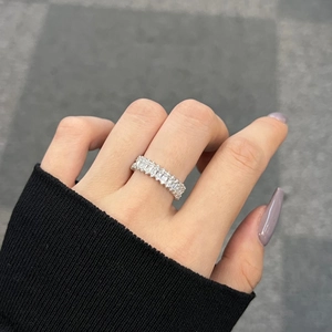 Macro view of S925 sterling silver ring featuring full eternity rectangular zircon inlay