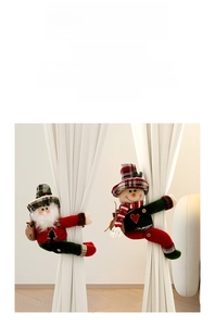 Detail of Christmas curtain buckles featuring Santa and snowman in red plaid fabric