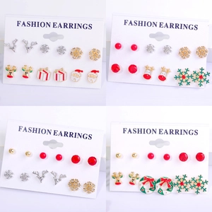 Christmas earring set with reindeer snowflake and santa motifs in festive colors