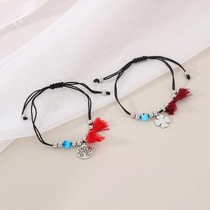 Adjustable woven clover and tree of life bracelets with evil eye beads and tassels