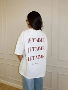 Women oversized white cotton T-shirt with red JE T'AIME print back view on model