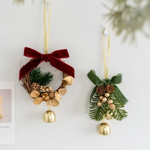 Christmas tree ornaments with red and green velvet bows, pine cones and gold bells