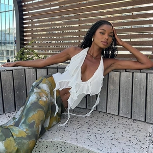 Close-up of white halter neck top with layered ruffles for elegant summer beach style