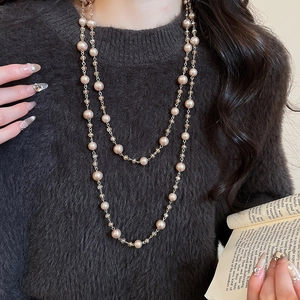 Detail of a French vintage double-layer necklace with champagne glass beads and pearls