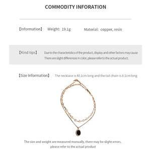 Detail view of gold-plated oval heart necklace with specifications and dimensions