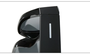 Macro detail of glossy black irregular sunglasses frame with silver metal trim on the temple