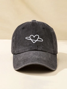 Close-up of heart saturn embroidery on washed cotton vintage baseball cap