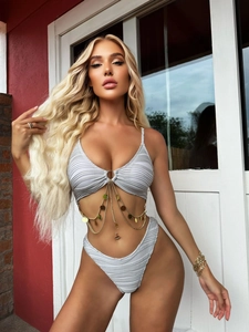 Detail of grey ribbed bikini featuring gold layered chains and sequin charms on the top