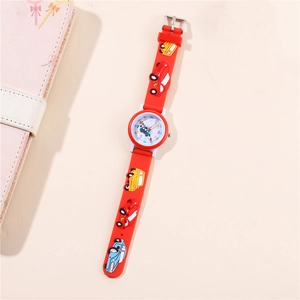 Detail view of red children quartz watch with 3D cartoon car patterns on silicone strap