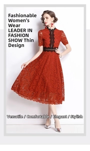 Detail of red lace A-line dress featuring black embroidery and slim waist design