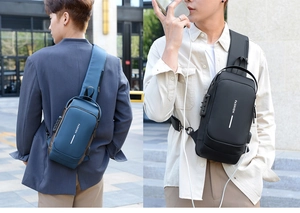 Detail of multi-functional chest bag featuring a built-in USB port and security lock