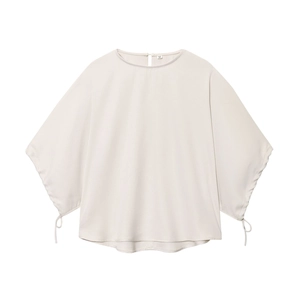 Women's minimalist puff sleeve cream blouse and relaxed trousers set in soft fabric
