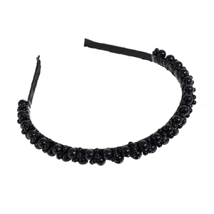 Elegant black beaded headband with layered glossy pearls on a fabric base