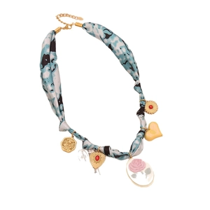 Silk scarf necklace with pink rose cameo, yellow heart and gold coin charms on white background