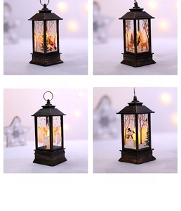 Detail view of four vintage Christmas LED lanterns with Santa, reindeer and angel patterns