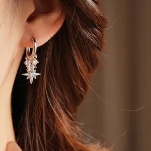 Sparkling silver star hoop earrings with light blue zircon stones for women