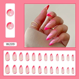 Detail of almond shaped press on nails with pink wave designs and full set layout
