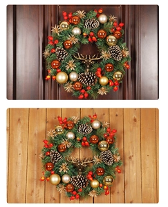 Detail of Christmas wreath with pine cones red berries and metallic reindeer head on wood