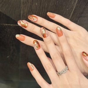 Japanese style amber press-on nails with gold foil and hand-painted gilt details