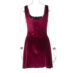 Close-up of the back of a burgundy velvet sleeveless dress with gathered pleated hem