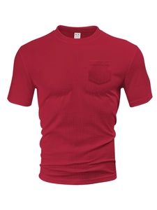 Close-up of red waffle knit texture and chest pocket on a casual men's t-shirt