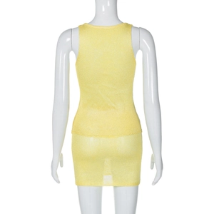 Rear view of yellow knit two-piece set showing breathable mesh texture on a mannequin