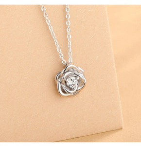 Detailed close-up of S925 sterling silver rose pendant necklace with a round sparkling zircon