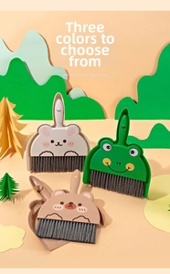 Close-up of mini cartoon animal dustpan and brush set featuring rabbit frog and bear