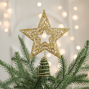 Sparkling gold glitter star tree topper with spiral base on a Christmas tree branch